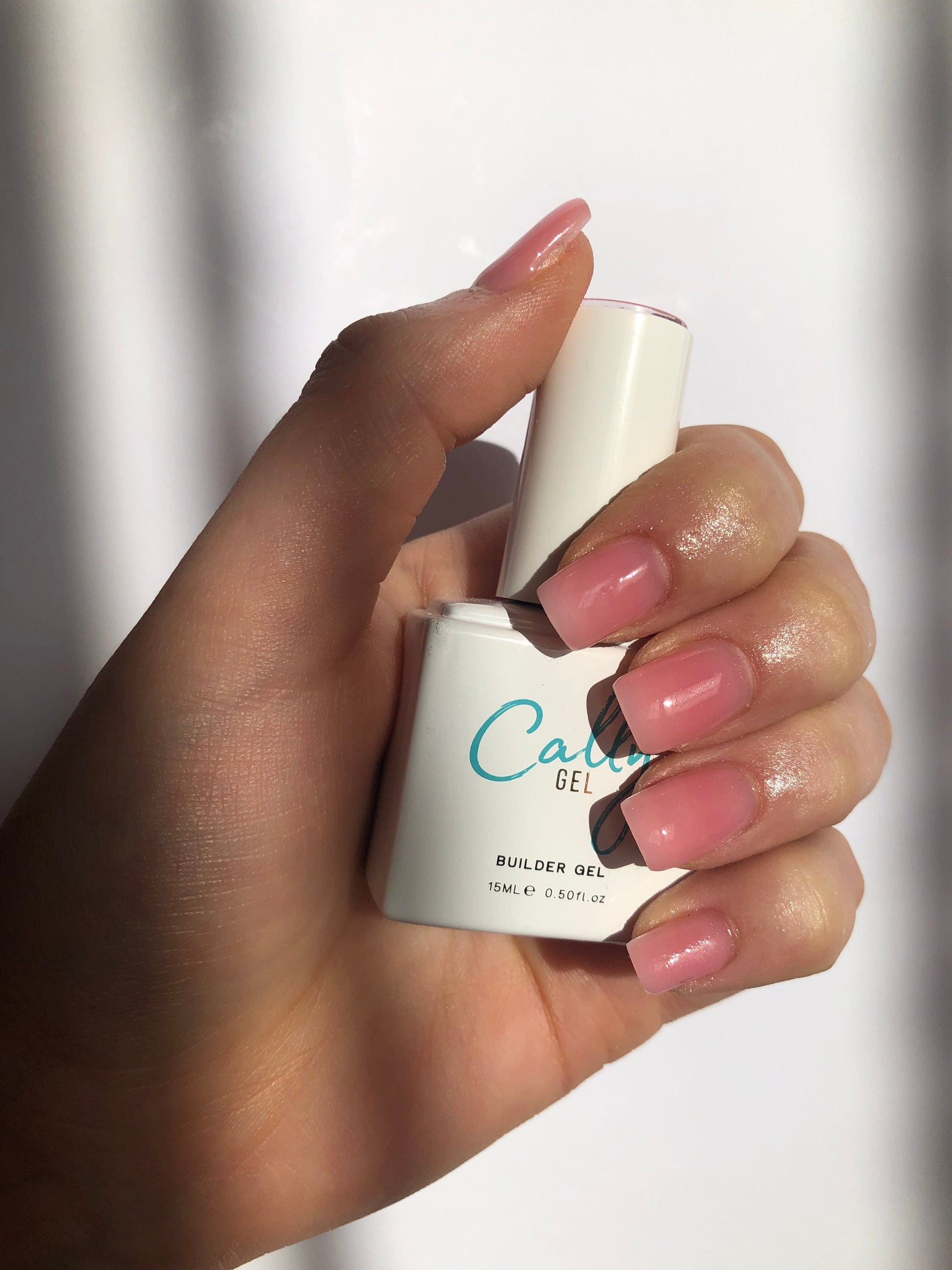Hand Manicured with Dream Cally Builder Gel Nail Polish and Bottle in Hand