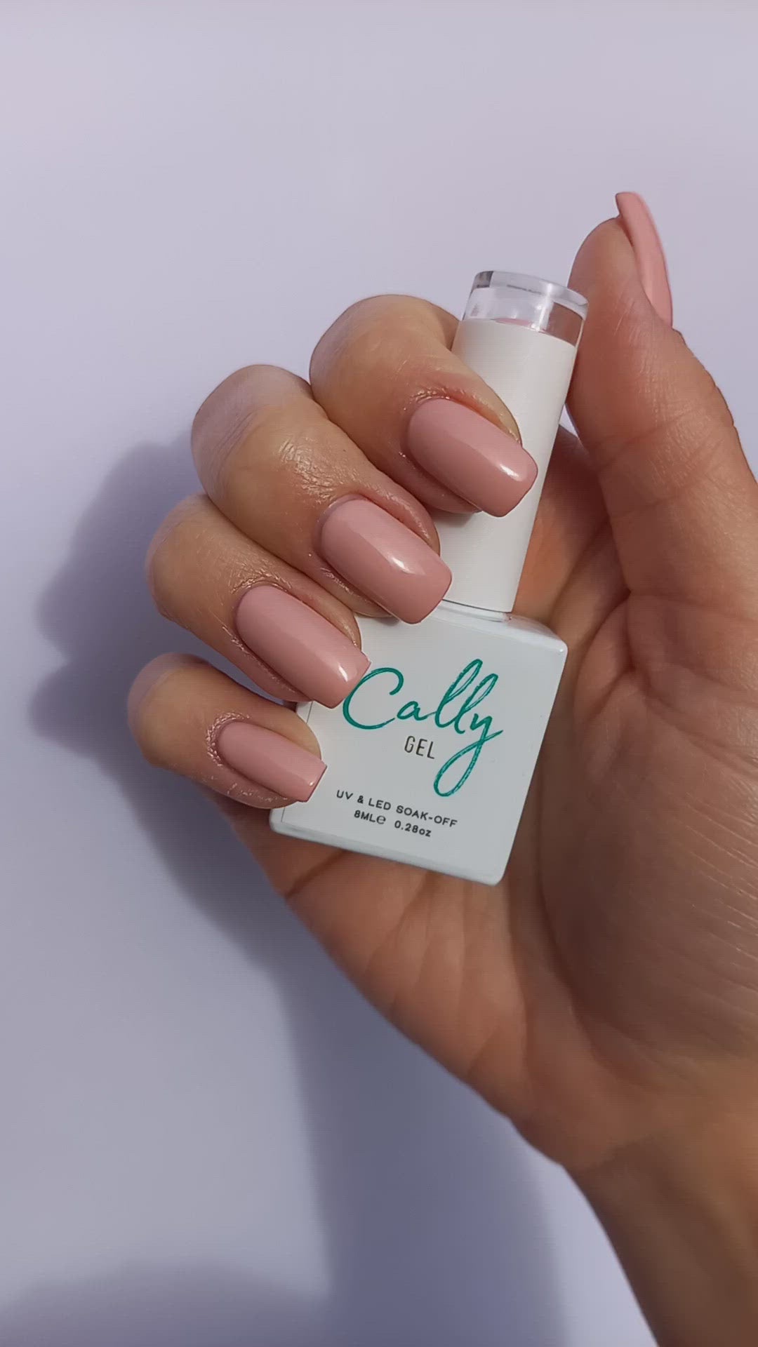 Showing Hand Manicured with Ballet Slippers Cally Gel Nail Polish and Bottle in Hand